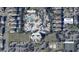 An aerial view of a home near a waterpark, clubhouse, and tennis court, showcasing its prime location at 220 Clawson Way, Kissimmee, FL 34747
