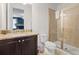 Bright bathroom with a glass shower, toilet and granite vanity at 220 Clawson Way, Kissimmee, FL 34747