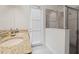 Bright bathroom with granite countertops, double sinks, and a glass-enclosed shower for a modern touch at 220 Clawson Way, Kissimmee, FL 34747
