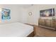 Comfortable bedroom with a dresser, mounted television and art at 220 Clawson Way, Kissimmee, FL 34747