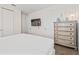 Modern bedroom with a wall-mounted TV and a spacious layout, offering style and comfort at 220 Clawson Way, Kissimmee, FL 34747
