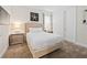 Cozy bedroom featuring neutral tones, soft carpet, and stylish furnishings, creating a serene retreat at 220 Clawson Way, Kissimmee, FL 34747