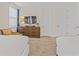 Comfortable bedroom featuring two beds, tv, and neutral carpet at 220 Clawson Way, Kissimmee, FL 34747
