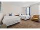 Bedroom featuring two twin beds, blue accents, and reading chair at 220 Clawson Way, Kissimmee, FL 34747
