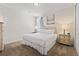 Serene bedroom featuring plush carpet, two nightstands, and soft lighting for a comfortable and restful space at 220 Clawson Way, Kissimmee, FL 34747