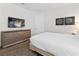 Comfortable bedroom with a wall-mounted TV and soft carpeting for a cozy, inviting atmosphere at 220 Clawson Way, Kissimmee, FL 34747