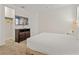 Well-lit bedroom with television, dresser, closet, and cozy carpet at 220 Clawson Way, Kissimmee, FL 34747