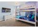 Bright bedroom with bunkbeds, TV, carpet, and decor at 220 Clawson Way, Kissimmee, FL 34747