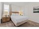 Comfortable bedroom featuring a queen bed, nightstands with lamps, and neutral decor at 220 Clawson Way, Kissimmee, FL 34747