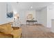 Bright hallway with tasteful decor, neutral colors, and soft carpeting for a welcoming transition between spaces at 220 Clawson Way, Kissimmee, FL 34747