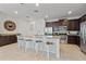 Spacious kitchen features granite countertops, stainless steel appliances, and a large island with seating at 220 Clawson Way, Kissimmee, FL 34747