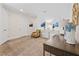 Inviting living room with soft carpeting, stylish decor, and ample space for relaxation and entertainment at 220 Clawson Way, Kissimmee, FL 34747