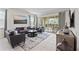 Bright and airy living room with comfortable seating and views of the outdoor patio through the sliding glass doors at 220 Clawson Way, Kissimmee, FL 34747