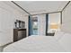 Luxurious main bedroom showcasing a queen bed, TV, and a view of the private pool at 220 Clawson Way, Kissimmee, FL 34747