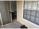 Small condo patio with sliding glass doors leading to living area at 1031 S Hiawassee Rd # 2524, Orlando, FL 32835