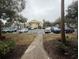 Apartment building with parking lot and landscaping at 1065 S Hiawassee Rd # 1416, Orlando, FL 32835