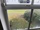 Window view of grassy backyard at 1065 S Hiawassee Rd # 1416, Orlando, FL 32835