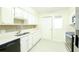 White kitchen cabinets and stainless steel appliances at 255 Crown Oaks Way, Longwood, FL 32779