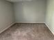 Spacious bedroom with neutral walls and plush carpeting at 5124 Conroy Rd # 27, Orlando, FL 32811