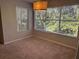 Spacious bedroom with neutral carpeting and large windows at 5124 Conroy Rd # 27, Orlando, FL 32811