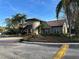 Community center with Spanish-style architecture and landscaping at 5124 Conroy Rd # 27, Orlando, FL 32811