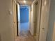 Clean hallway with neutral walls and carpet at 5124 Conroy Rd # 27, Orlando, FL 32811