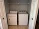 Stackable washer and dryer in a small laundry closet at 5124 Conroy Rd # 27, Orlando, FL 32811