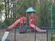 Community playground with slides and climbing structures for children at 5124 Conroy Rd # 27, Orlando, FL 32811