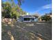 View of the home's backyard, showing a large lawn and screened porch at 305 Pinecrest Rd, Mount Dora, FL 32757