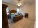 Bedroom with wooden bed frame and ceiling fan at 305 Pinecrest Rd, Mount Dora, FL 32757