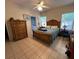 Bedroom with wooden bed frame and en-suite bathroom at 305 Pinecrest Rd, Mount Dora, FL 32757