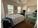 Bedroom with queen bed, TV, and mirrored closet at 305 Pinecrest Rd, Mount Dora, FL 32757