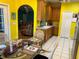 Kitchen with wood cabinets, view into living room at 305 Pinecrest Rd, Mount Dora, FL 32757