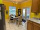 Bright kitchen with wood cabinets, and dining area at 305 Pinecrest Rd, Mount Dora, FL 32757