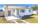 Newly renovated home with carport and well-manicured lawn at 907 2Nd St, Port Orange, FL 32129