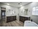 Modern bathroom with double vanities and a freestanding tub at 3045 Dove Ln, Mulberry, FL 33860