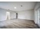 Spacious bedroom with wood-look floors and access to exterior at 3045 Dove Ln, Mulberry, FL 33860