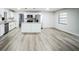 Bright kitchen featuring white cabinets and a kitchen island at 3045 Dove Ln, Mulberry, FL 33860