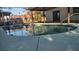 Relaxing kidney-shaped pool with a concrete deck at 3045 Dove Ln, Mulberry, FL 33860