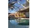 Inviting screened-in pool with a spacious deck at 3045 Dove Ln, Mulberry, FL 33860