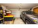 Garage with storage shelves and ample space for a vehicle at 3032 Lakes Crest Ave, St Cloud, FL 34772