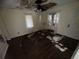 Bedroom with water damage and debris on floor at 216 N Salem St, Eustis, FL 32726