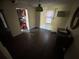 View of dining room showing damage and kitchen access at 216 N Salem St, Eustis, FL 32726