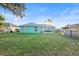 Spacious backyard with a teal house and above ground pool at 3249 Lake Helen Osteen Rd, Deltona, FL 32738