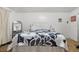 Cozy bedroom with a floral comforter and a full-size bed at 3249 Lake Helen Osteen Rd, Deltona, FL 32738