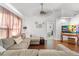 Living room with sectional sofa and hardwood floors at 3249 Lake Helen Osteen Rd, Deltona, FL 32738