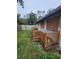 Small house with wooden deck and boarded windows at 4054 Columbia St, Orlando, FL 32811