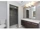 Updated bathroom with gray tile, modern vanity, and shower at 4539 Wild Rose Ct, Orlando, FL 32808