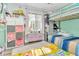 Playful bedroom featuring a loft bed, bright decor, and ample storage at 4539 Wild Rose Ct, Orlando, FL 32808