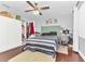 Cozy bedroom with ceiling fan, lots of natural light, and ample storage at 4539 Wild Rose Ct, Orlando, FL 32808